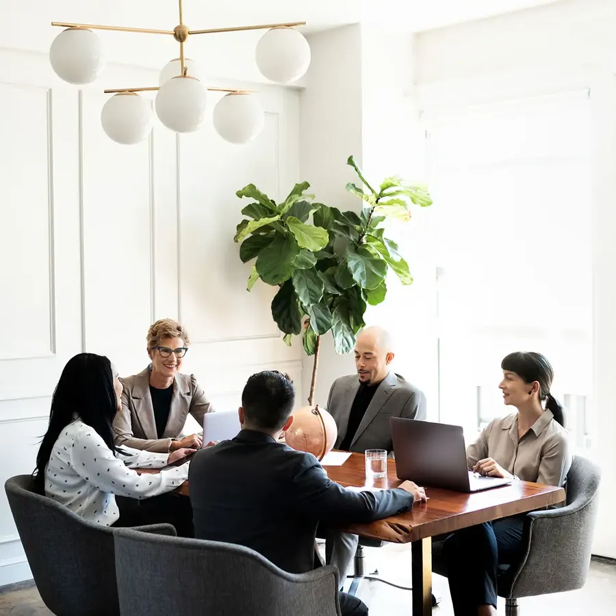 Attorneys and clients meeting around a conference table